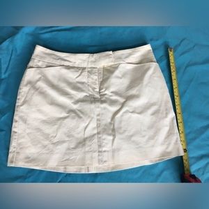 Y2k Bebe ivory miniskirt.